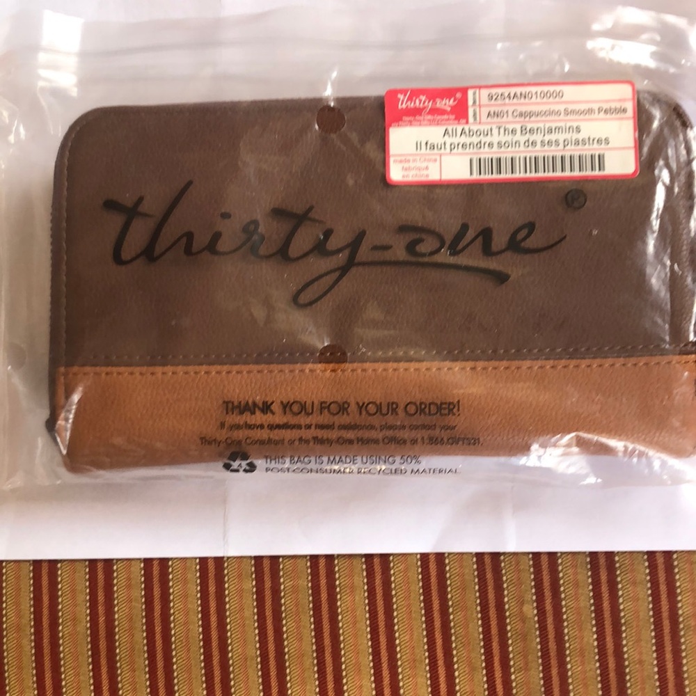 All About The Benjamins
-One Brown and Tan Wallet